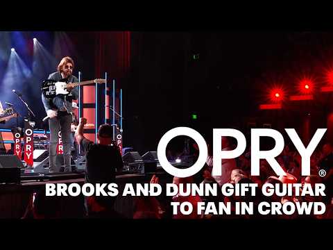 Brooks & Dunn Gift Guitar To Fan In Crowd!